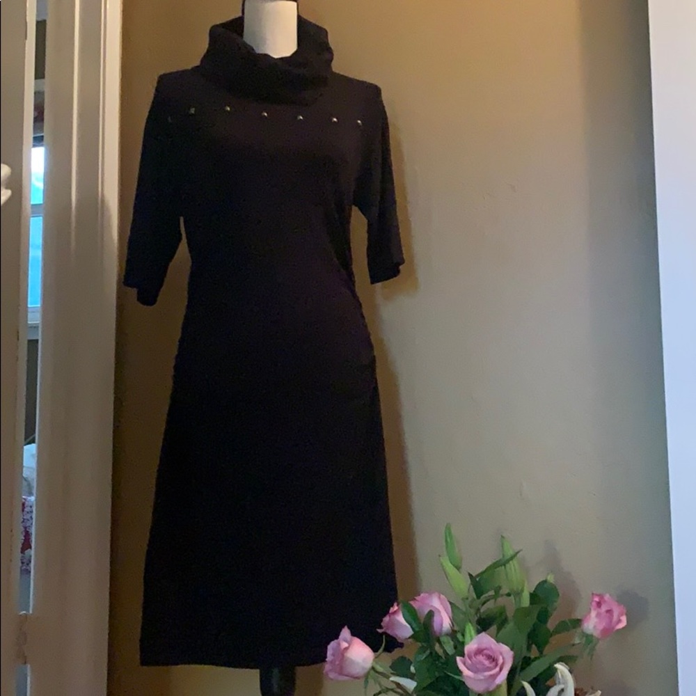 Black sweater dress with brass detail